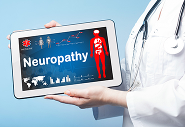 Doctor showing patient causes of peripheral neuropathy