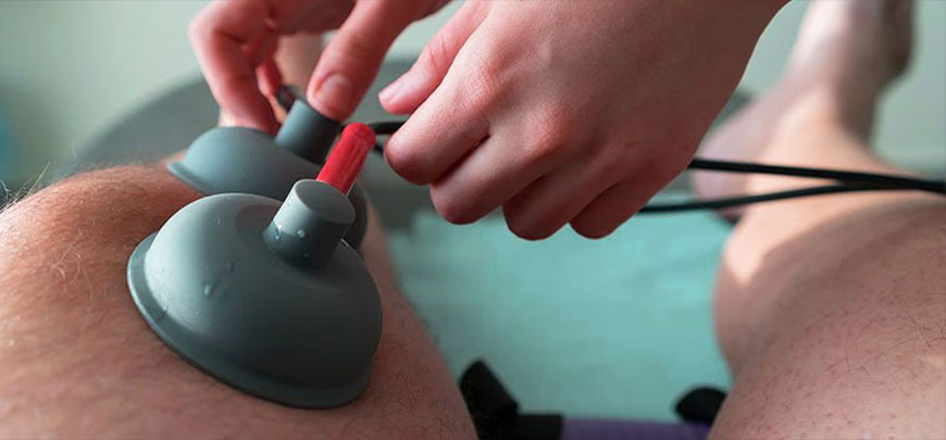 patient receiving Electroanalgesic Therapy as part of the neuropathy treatment protocol at Liebman Wellness Center in Marlton